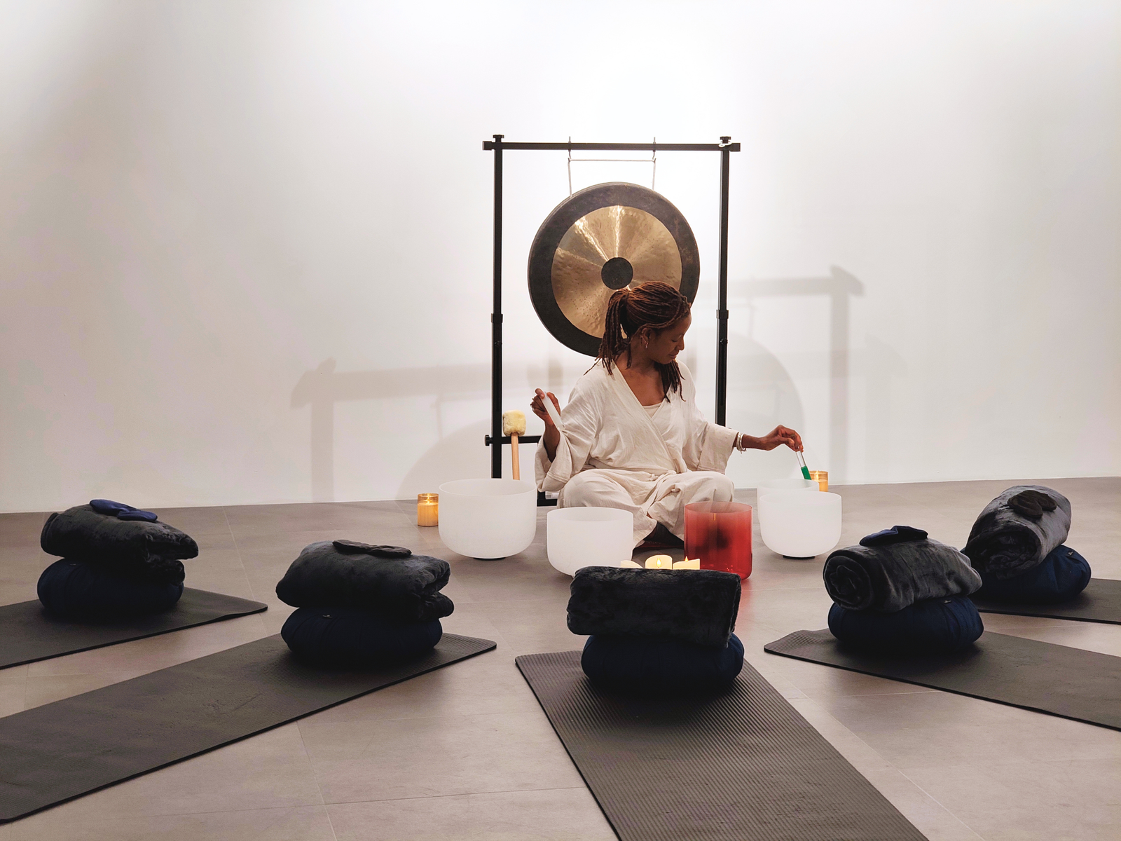 Sanctue sound bath prepared with crystal bowls, mats and gong